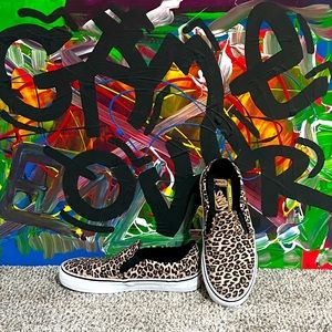 Vans leopard slip-ons.